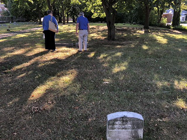Cindy Edwards and Fred Millner exploring Burlington Meeting House's cemetery